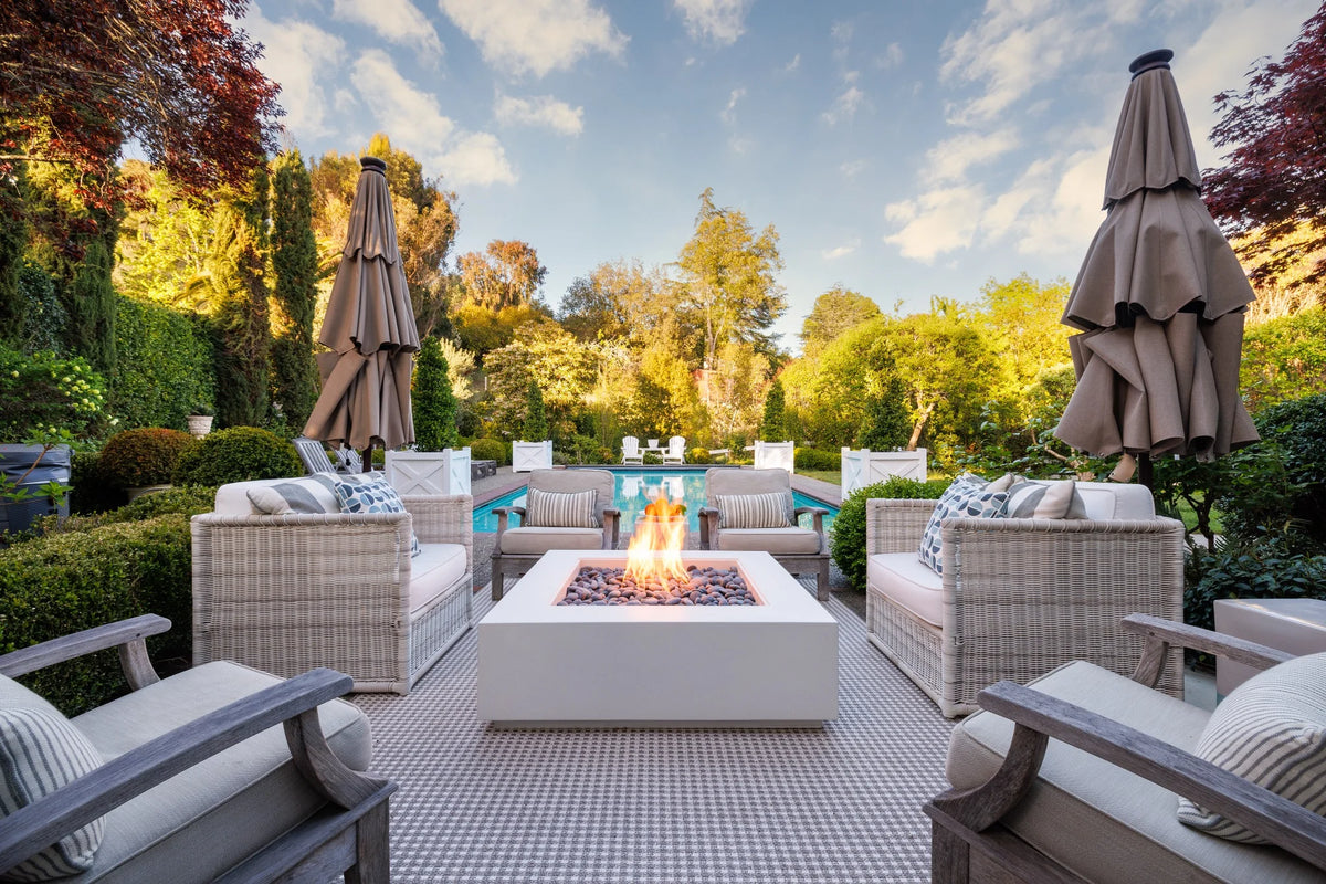 Lumacast concrete fire table on a garden terrace